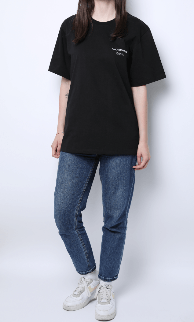 WaveWear Blue Moon performance shirt in black worn with blue jeans and white sneakers