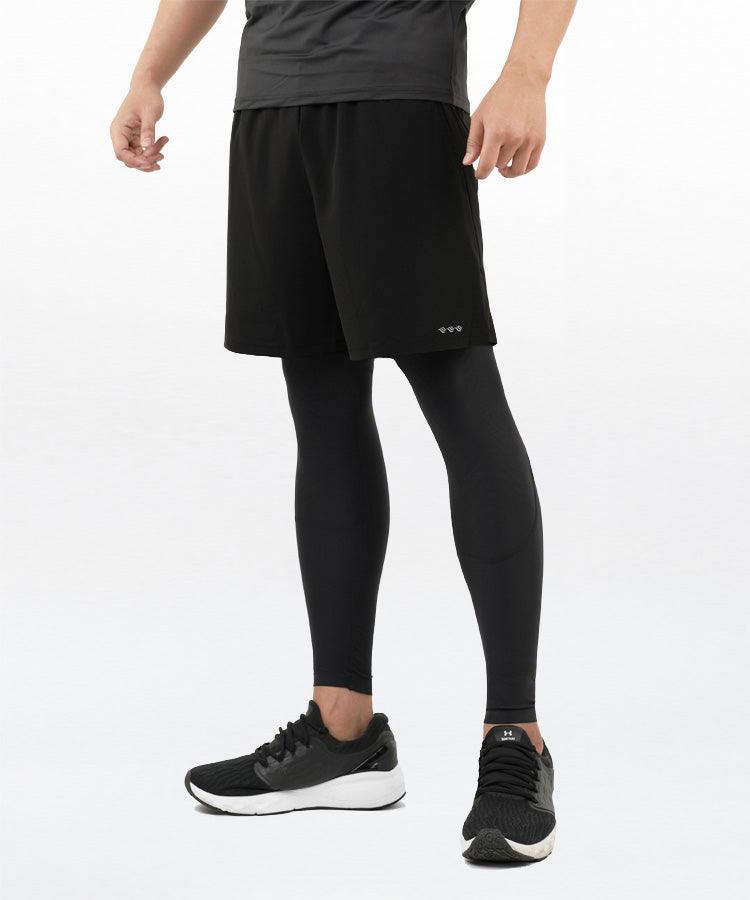 WaveWear black compression running shorts for men worn over black running leggings with black running shoes
