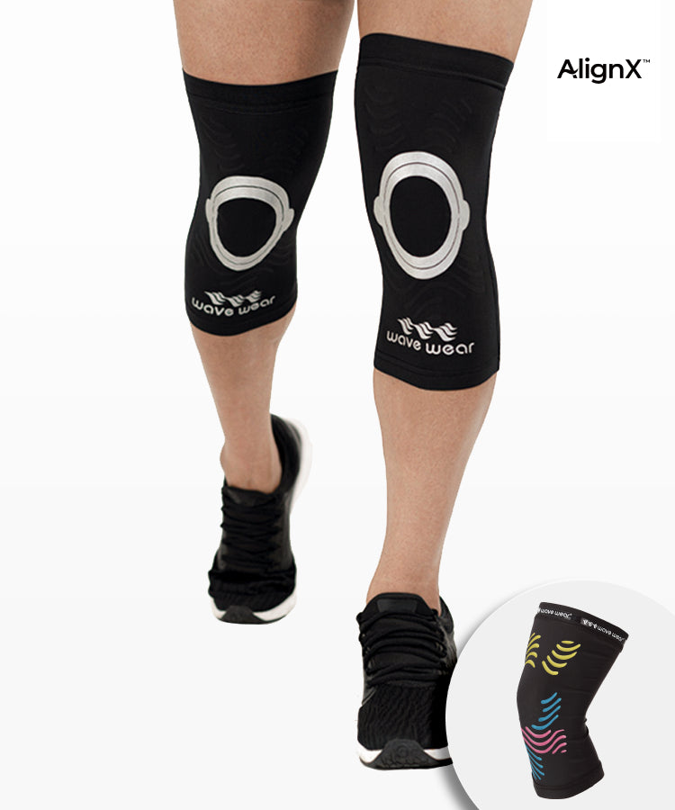 WaveWear kinesiology knee support sleeve in black worn on legs with circular knee design