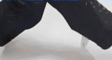 A hand presses WaveWear fabric; the silicone grips