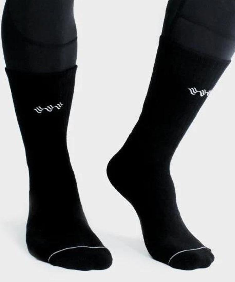 WaveWear black compression athletic socks worn on feet with white logo and reinforced toes