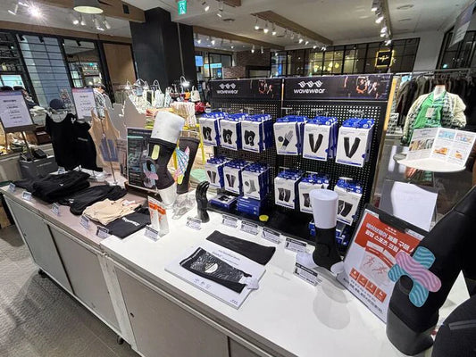 Display of the best compression gear for sports recovery including sleeves and supports in a retail store