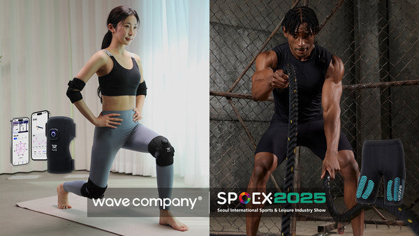 Man and woman using wearable fitness technology devices demonstrating fitness technology trends 2025