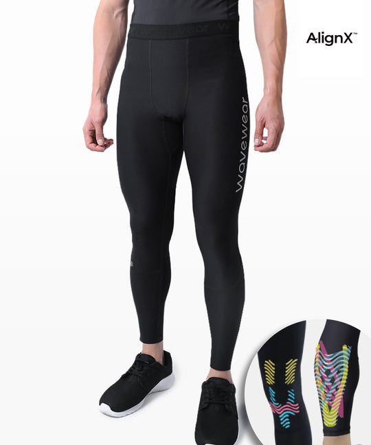 Man wearing WaveWear L20 Hetite Knee and Calf Kinesiology Compression Leggings in black with AlignX taping detail inset