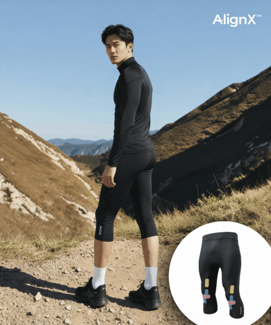Man wearing WaveWear 3/4 Capri Compression Leggings CL20 in black outdoors with AlignX kinesiology taping detail inset