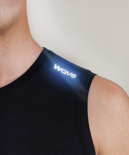 R10 Sleeveless Compression Top close-up of illuminated Wave logo on chest showing premium branding detail