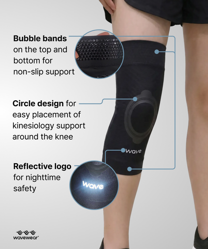 Schwarze K2 Kniebandage, Vorderseite mit Merkmalen: Bubble-Bänder, rundes Kinesiologie-Design und reflektierendes Logo
