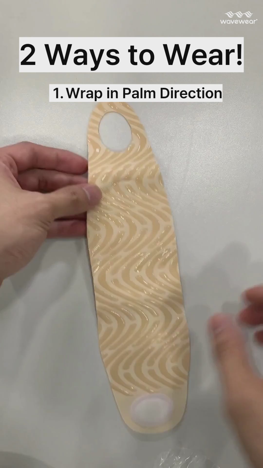 How to wear the H1 wrist wrap: thumb through the hole, then wrap around the wrist