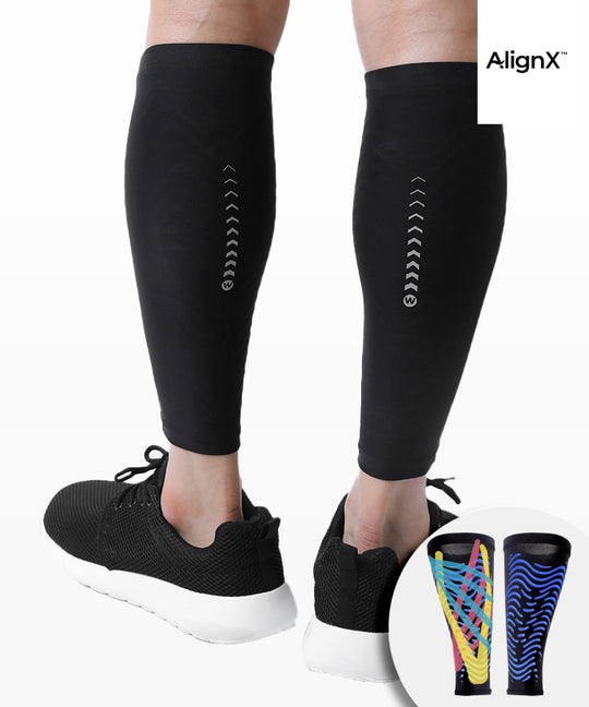 WaveWear C2 Calf Recovery Kinesiology Compression Sleeves in black worn on both legs showing AlignX chevron pattern with colorful variant inset