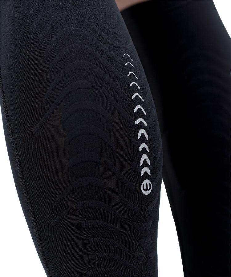 WaveWear C2 Calf Recovery Kinesiology Compression Sleeves close-up of black sleeve showing chevron arrow detail and wave-ridged compression texture