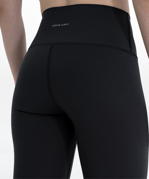 Zen Workout Compression Leggings Y1 close-up back waist detail showing wave wear logo, high waistband, and smooth compression fabric