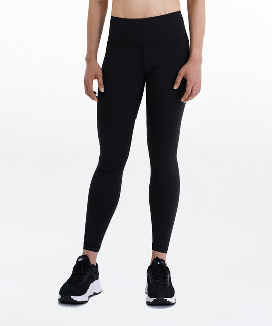 WaveWear Zen Workout Compression Leggings Y1 front view on model in black showing high waist fit and full-length slim design with black sneakers