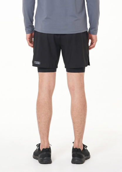 Full-length back view with the reflective label on the outer short