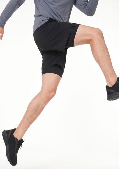Running from behind, inner layer visible under the outer short