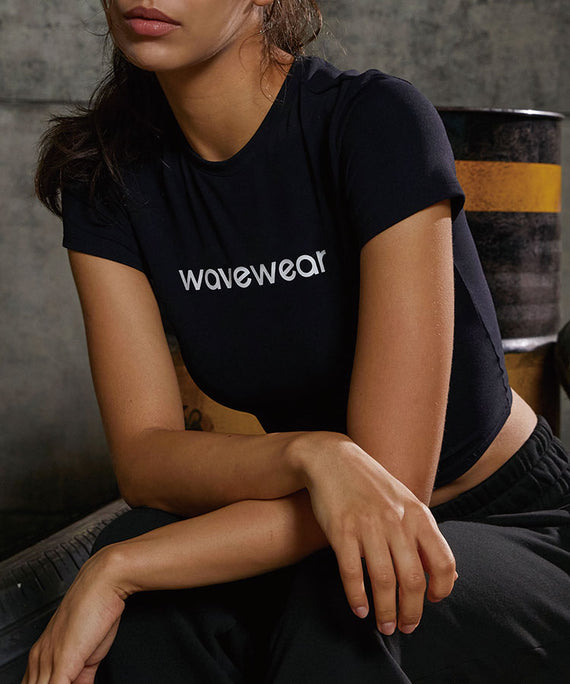 WaveWear black compression crop top for women with short sleeves and logo on front