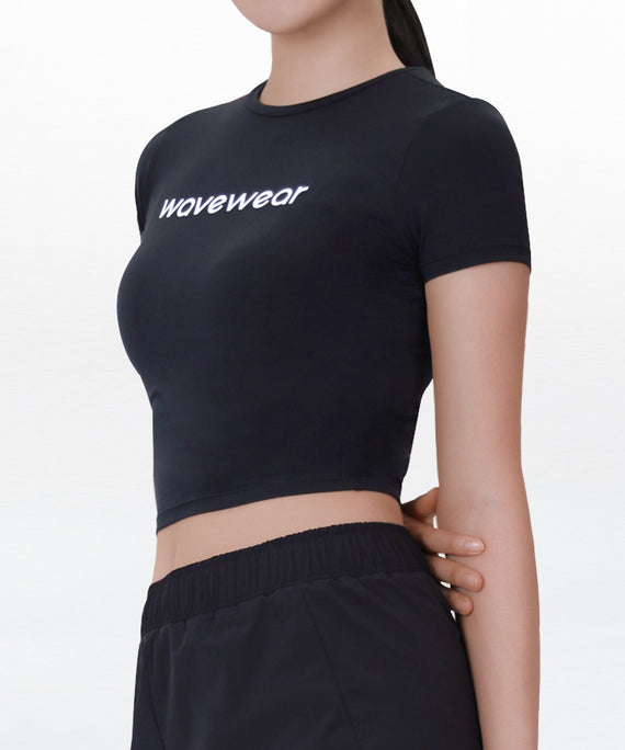 Black WaveWear compression crop top for women with short sleeves and fitted design