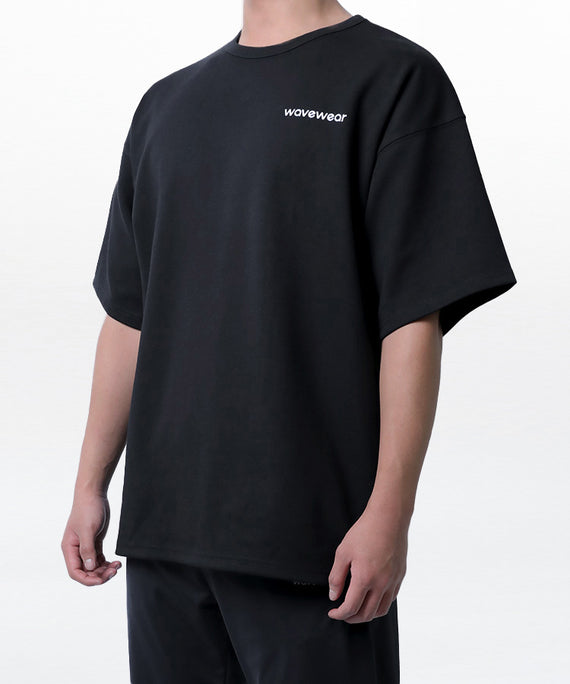 WaveWear black dynamic oversized fit t-shirt with relaxed sleeves and minimal logo on chest