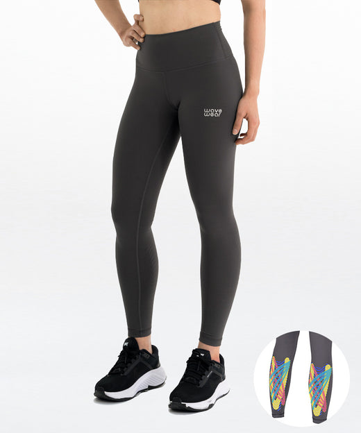 WaveWear Y10 Calf Therapy Tape Compression Leggings front view on model in charcoal grey with high waist fit and colorful calf kinesiology taping zone product inset