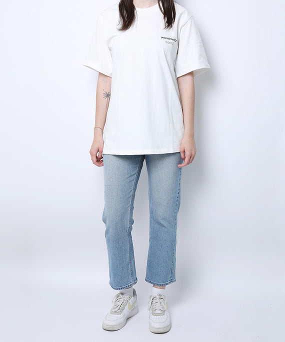 WaveWear white comfortable sports tee for men paired with light blue jeans and white sneakers