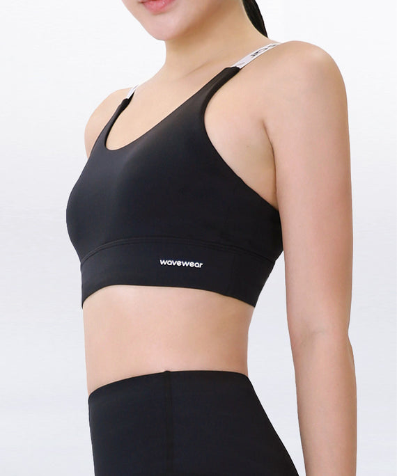 WaveWear black compression sports bra with white adjustable straps and supportive fit